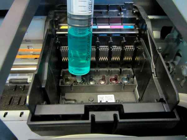 Зачем и чем промыть головку принтера?